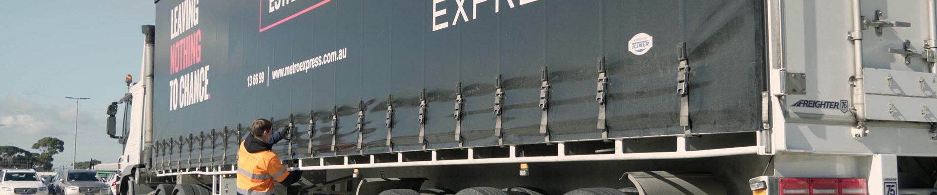 Metro truck in loading facility being secured.