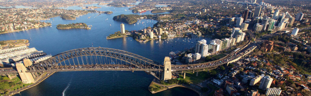 Birds eye view of Sydney harbour bridge with traffic